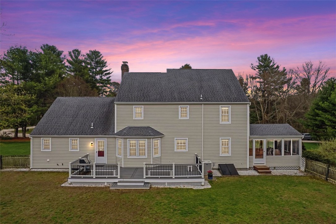 32 Lisa Lane Hopkinton, RI 02832 - Photo 45 of 50 Let's head back outside! An expansive Trex deck, firepit lounge area, and fully fenced, park-like yard create the ultimate setting for entertaining, relaxing, and making memories year-round.