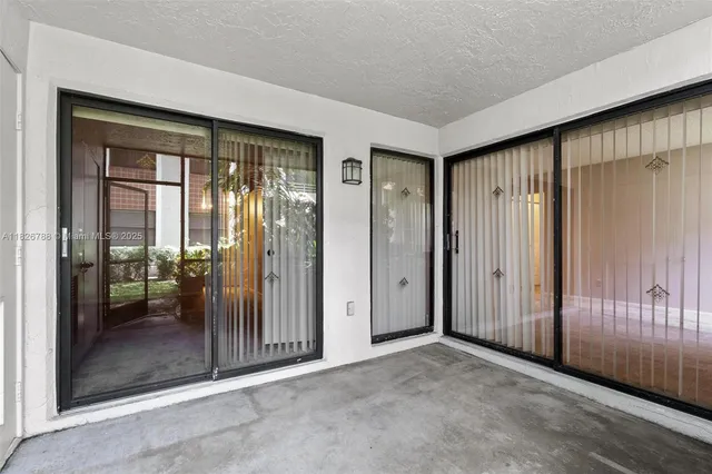 a picture of a bench in front of a wall