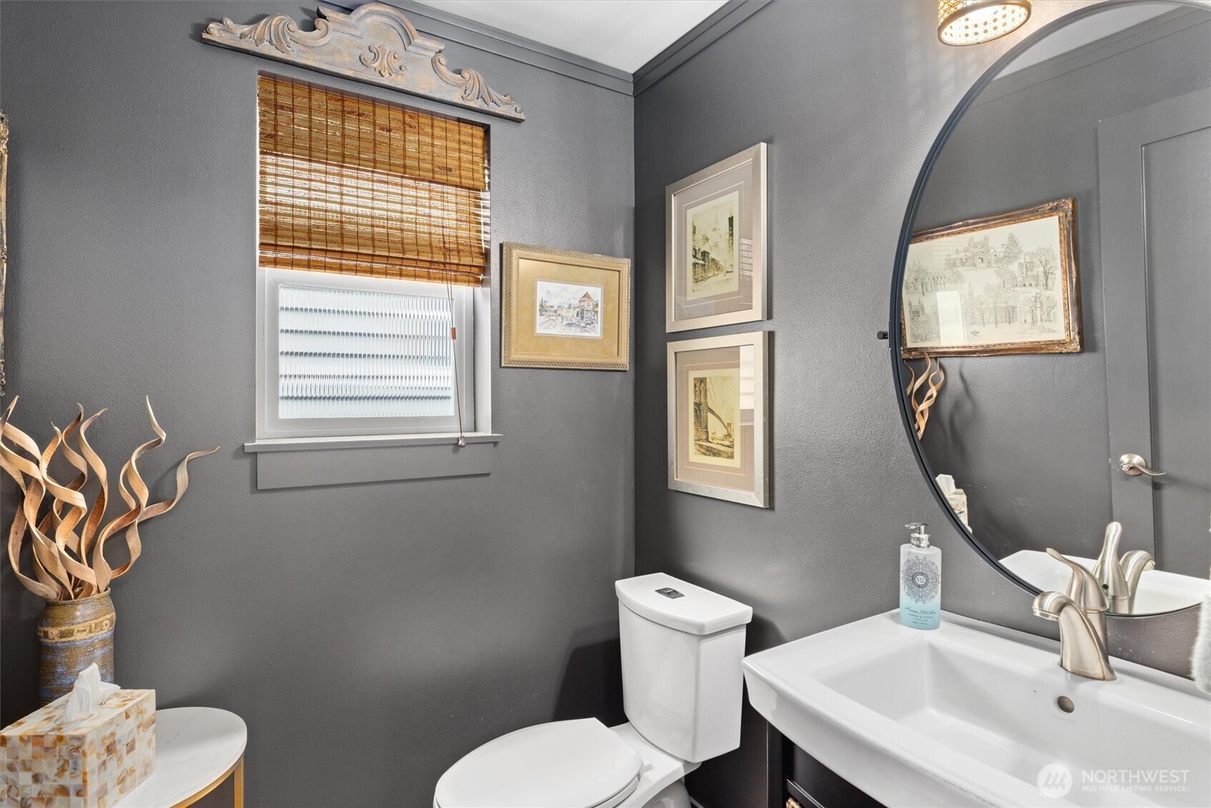 3414 33rd Avenue Southwest Seattle, WA 98126 - Photo 14 of 26 a bathroom with a toilet a sink and a mirror