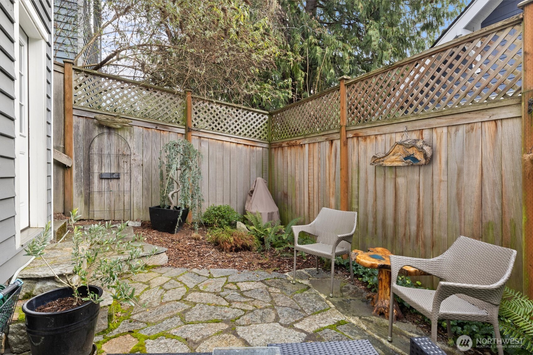 3414 33rd Avenue Southwest Seattle, WA 98126 - Photo 26 of 26 a view of a chairs and table in backyard of the house