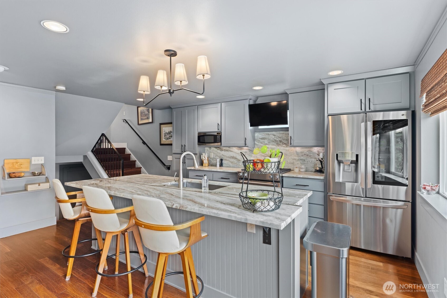 3414 33rd Avenue Southwest Seattle, WA 98126 - Photo 8 of 26 a kitchen with refrigerator and chairs