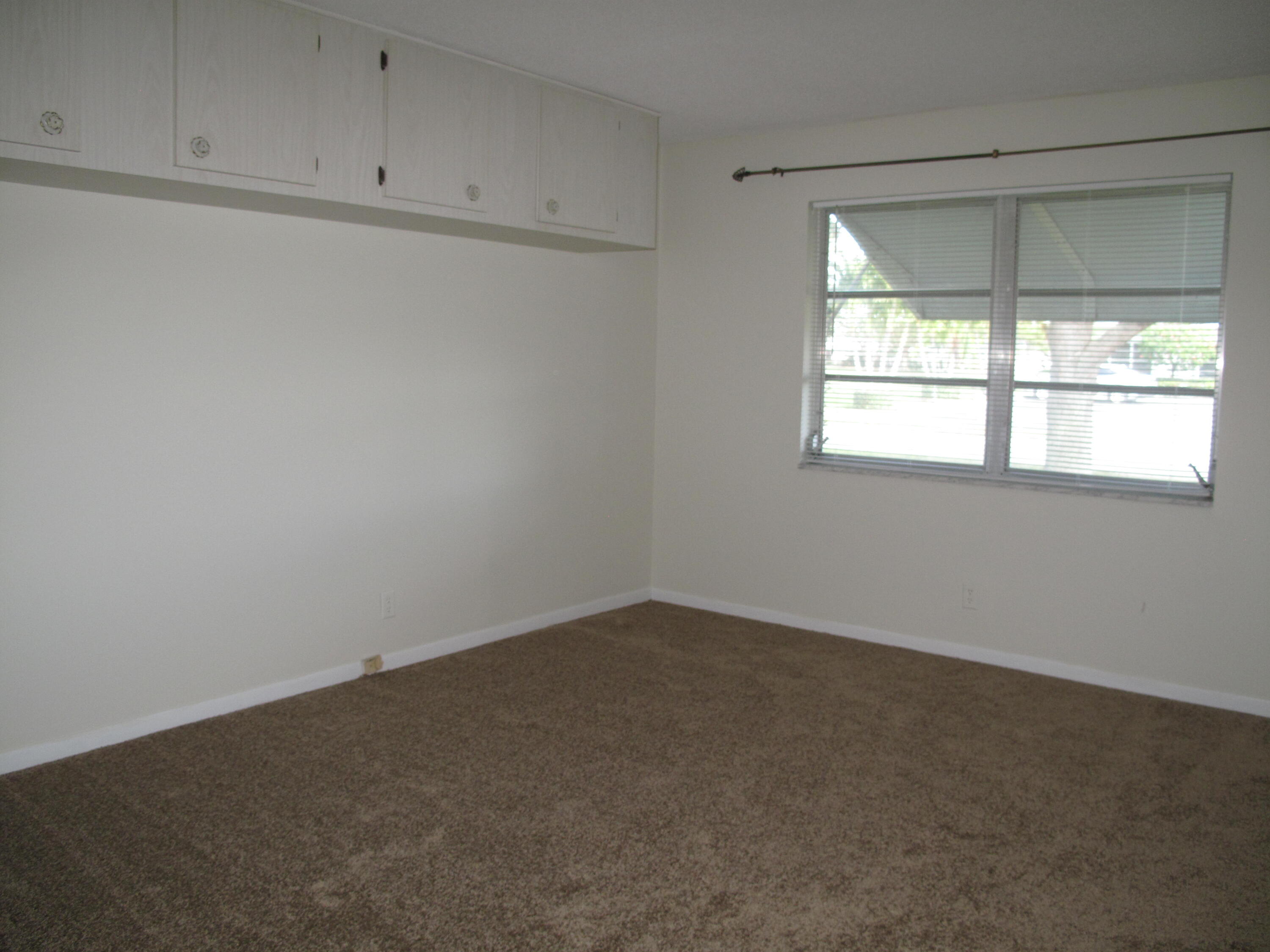 277 West High Point Court, Unit D Delray Beach, FL 33445 - Photo 21 of 47 Guest bedroom