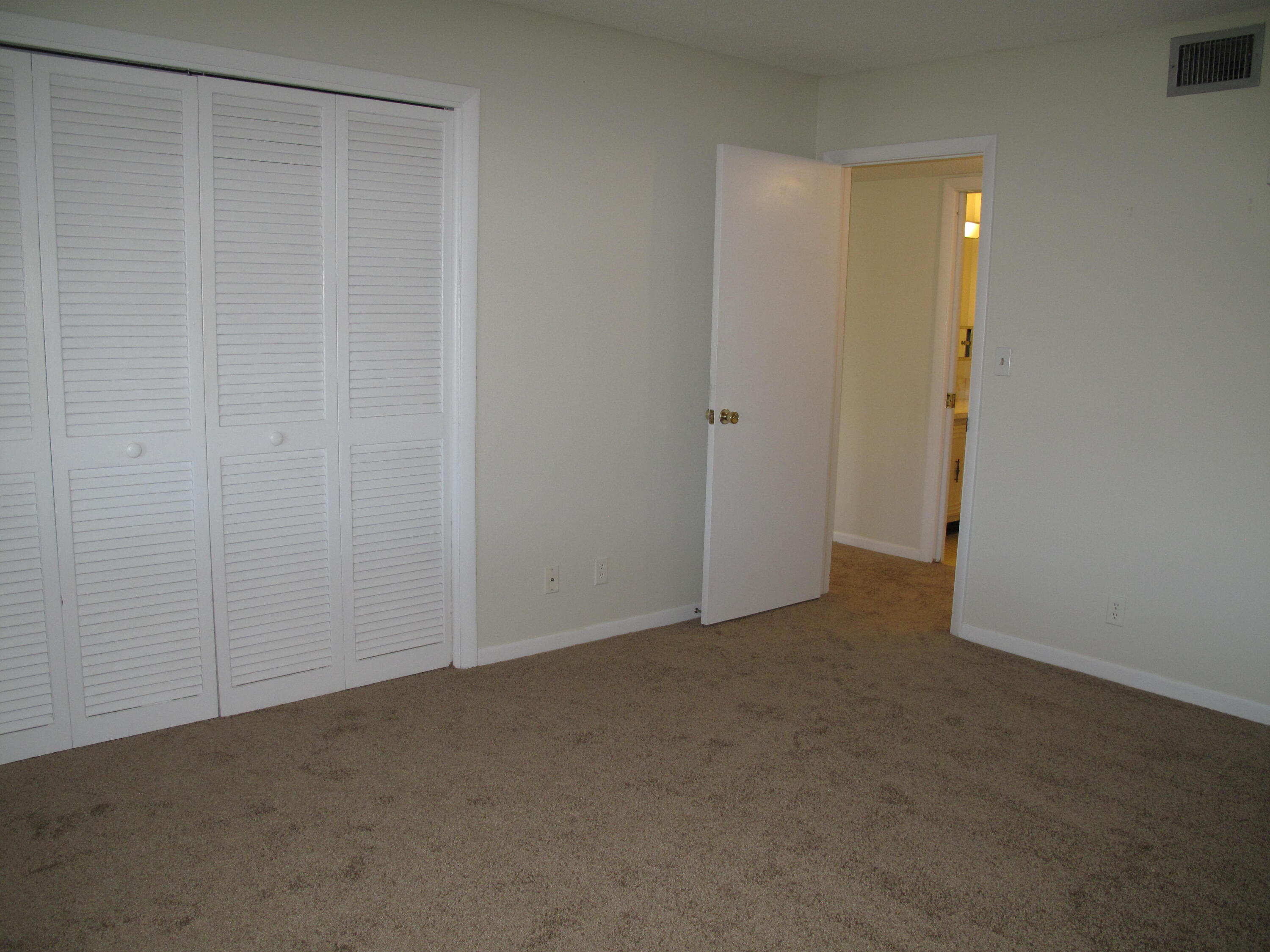 277 West High Point Court, Unit D Delray Beach, FL 33445 - Photo 22 of 47 Guest bedroom