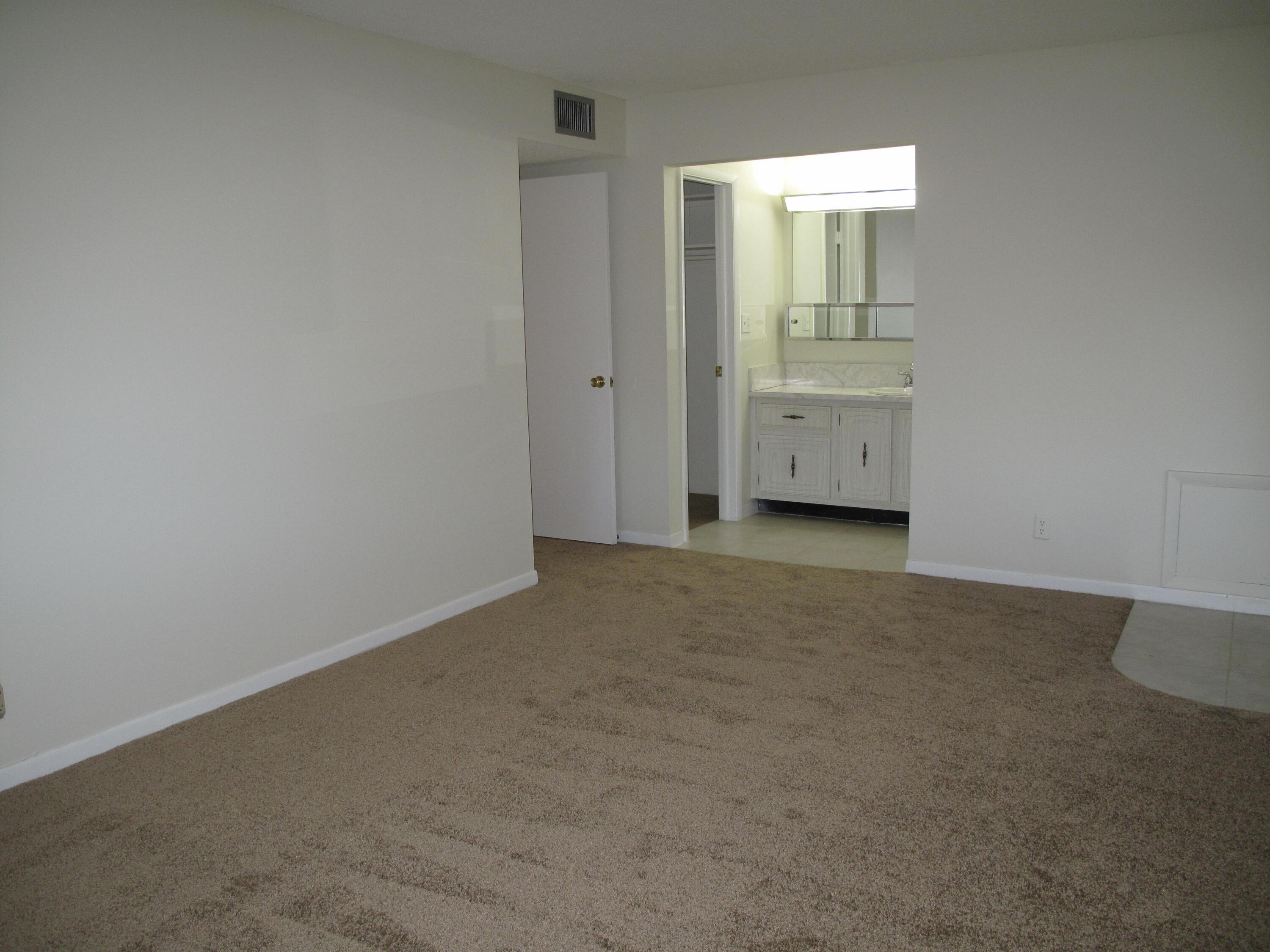 277 West High Point Court, Unit D Delray Beach, FL 33445 - Photo 27 of 47 Master bedroom