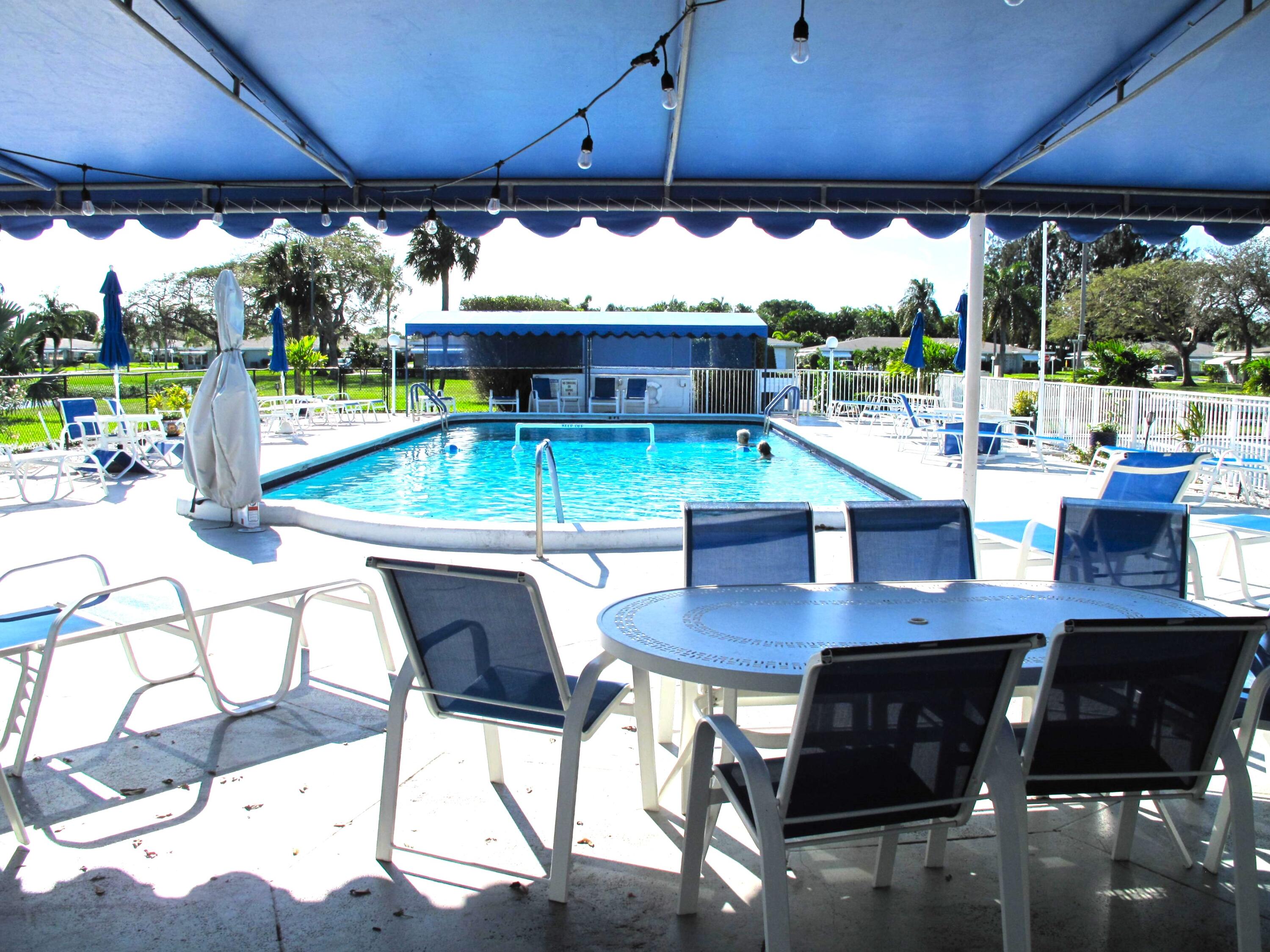 277 West High Point Court, Unit D Delray Beach, FL 33445 - Photo 41 of 47 Pool and deck area (1)