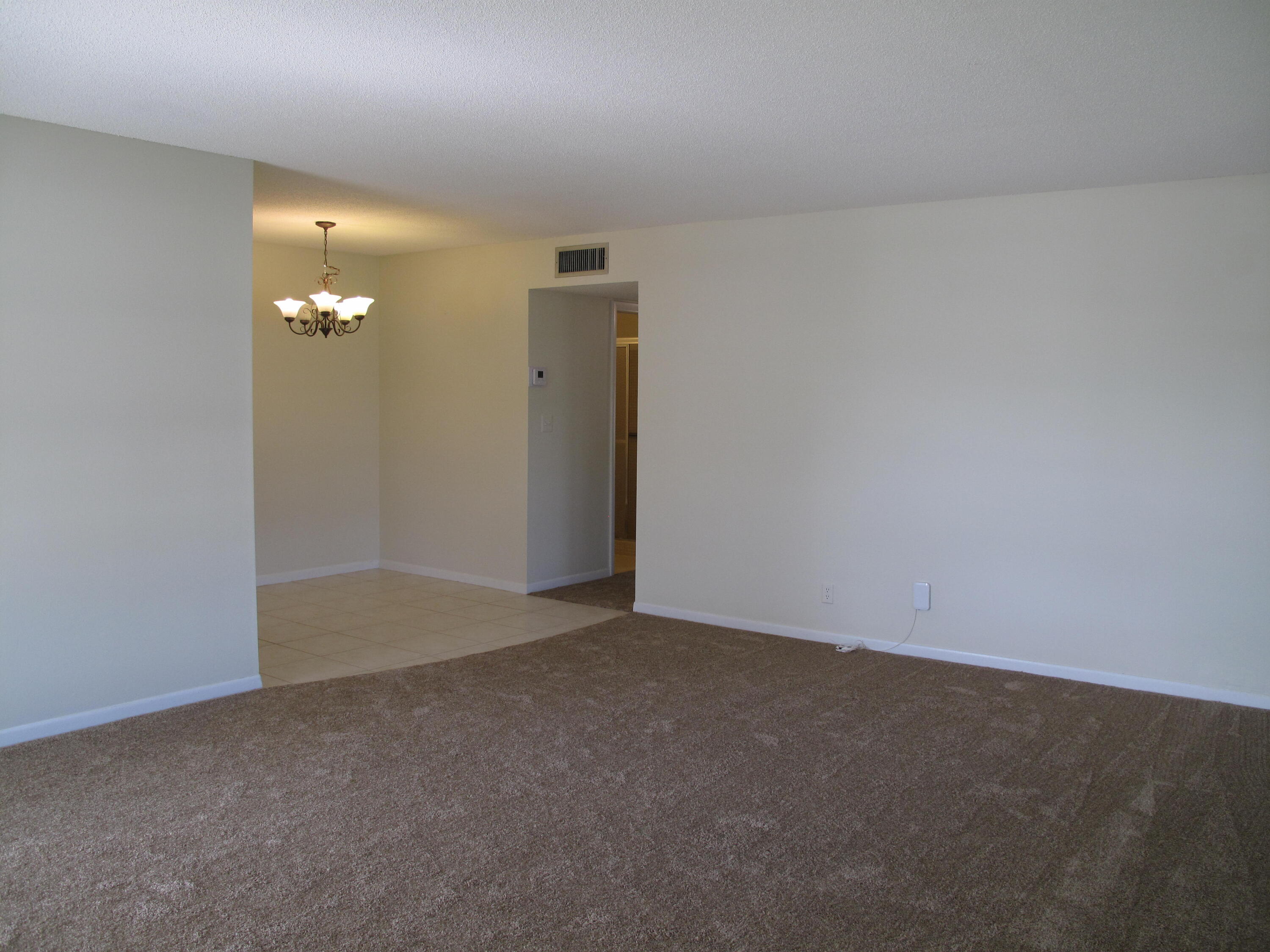 277 West High Point Court, Unit D Delray Beach, FL 33445 - Photo 6 of 47 living and dining area