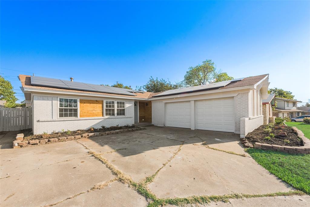 a view of a front of a house with a yard