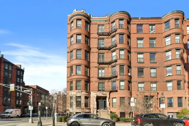 a front view of a building with lot of windows