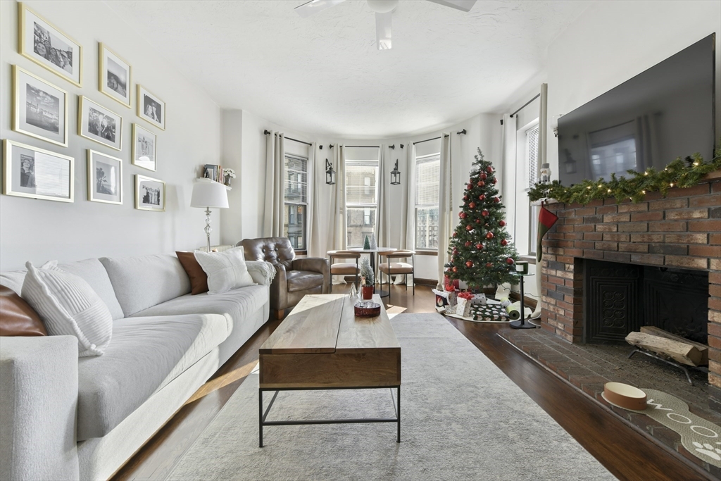 411 Marlborough Street, Unit 9 Boston, MA 02115 - Photo 2 of 20 a living room with furniture fireplace and potted plants