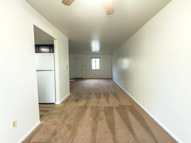 a kitchen with a refrigerator stove and sink