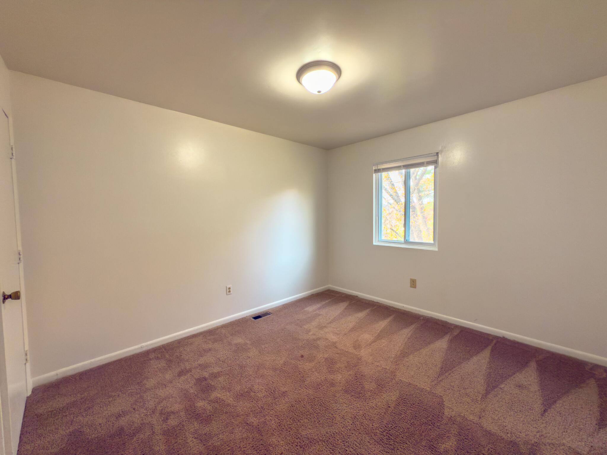 5131 Overland Drive, Unit A Roanoke, VA 24018 - Photo 8 of 9 an empty room with a window