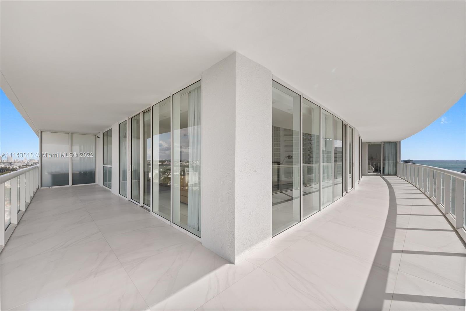 450 Alton Road, Unit 2301 Miami Beach, FL 33139 - Photo 17 of 21 a view of a bedroom with windows