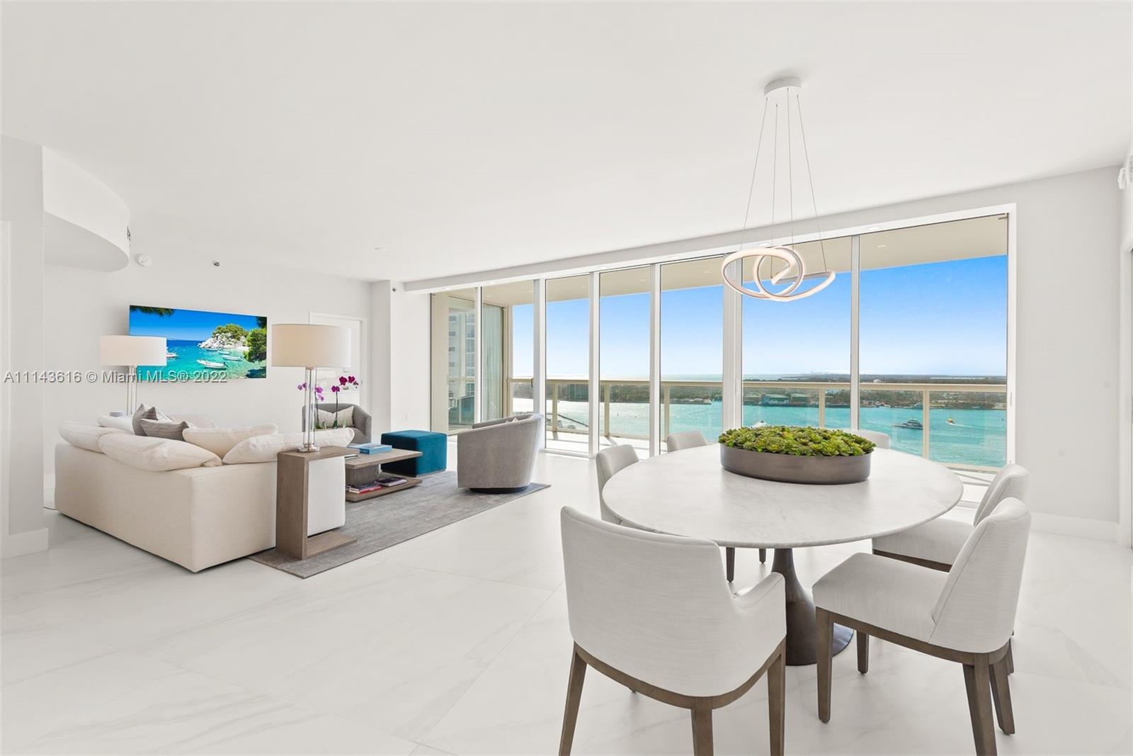 450 Alton Road, Unit 2301 Miami Beach, FL 33139 - Photo 5 of 21 a living room with furniture and a table