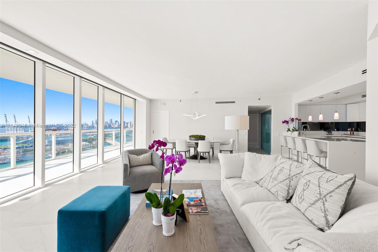 450 Alton Road, Unit 2301 Miami Beach, FL 33139 - Photo 6 of 21 a living room with furniture and a large window