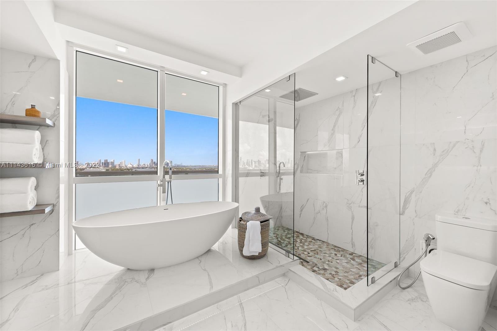 450 Alton Road, Unit 2301 Miami Beach, FL 33139 - Photo 7 of 21 a bathroom with a bathtub and a shower