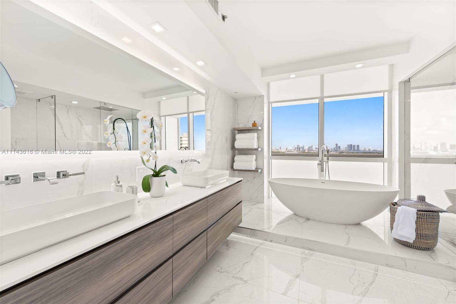 450 Alton Road, Unit 2301 Miami Beach, FL 33139 - Photo 8 of 21 a large bathroom with a large tub and sink