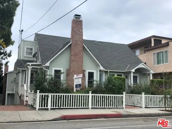 a view of a house with a street