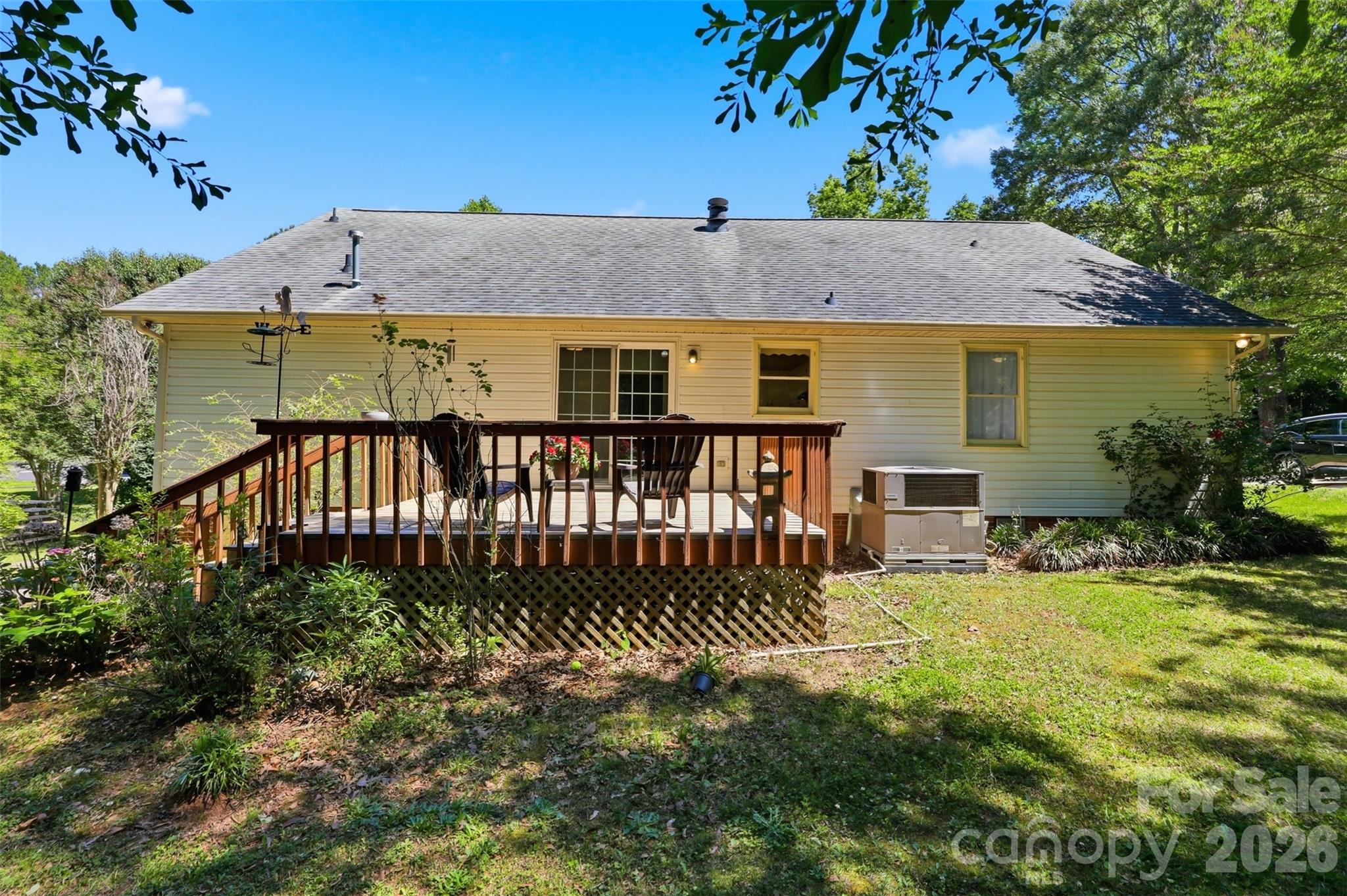 913 Pleasant Ridge Road Fort Mill, SC 29715 - Photo 25 of 40 a view of a house with a yard and deck