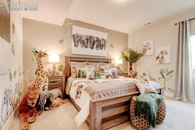 a bedroom with a bed and a painting on the wall