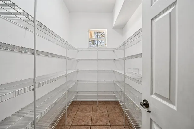 a view of an entryway with a chandelier fan