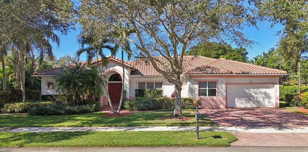 4181 Southwest 141st Avenue Davie, FL 33330 - Photo 2 of 61 a front view of a house with a yard