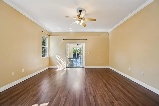 wooden floor in an empty room with a window