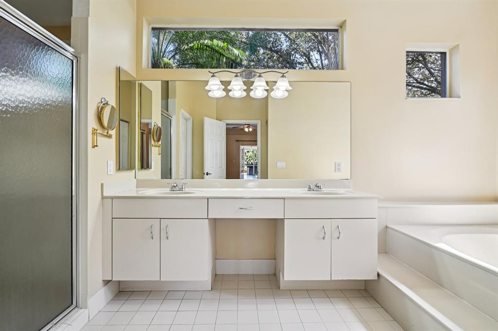 4181 Southwest 141st Avenue Davie, FL 33330 - Photo 27 of 61 a bathroom with a sink and a mirror