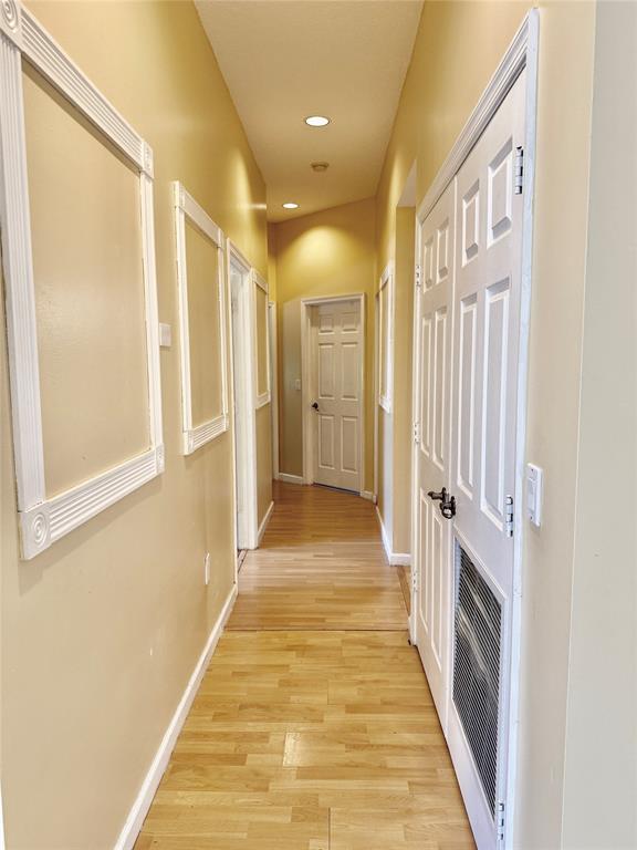 4181 Southwest 141st Avenue Davie, FL 33330 - Photo 30 of 61 a view of a hallway with wooden floor and a bathroom