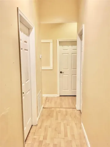 a view of a park with a tree in the background