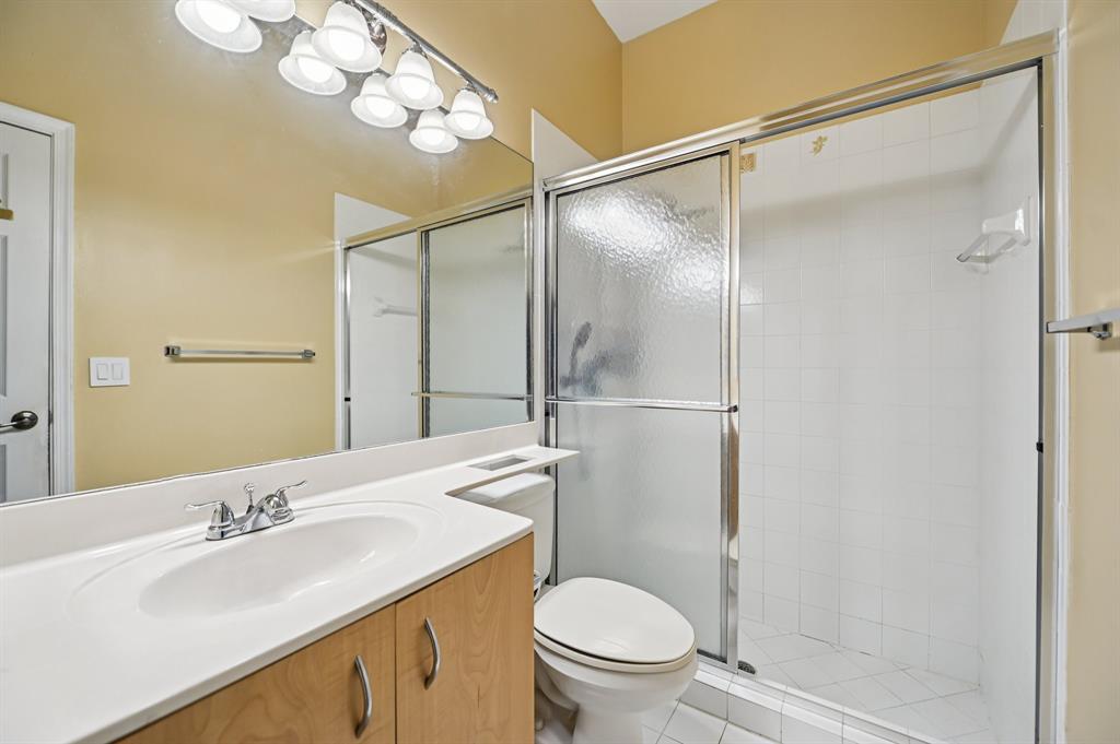 4181 Southwest 141st Avenue Davie, FL 33330 - Photo 34 of 61 a bathroom with a sink toilet vanity and shower