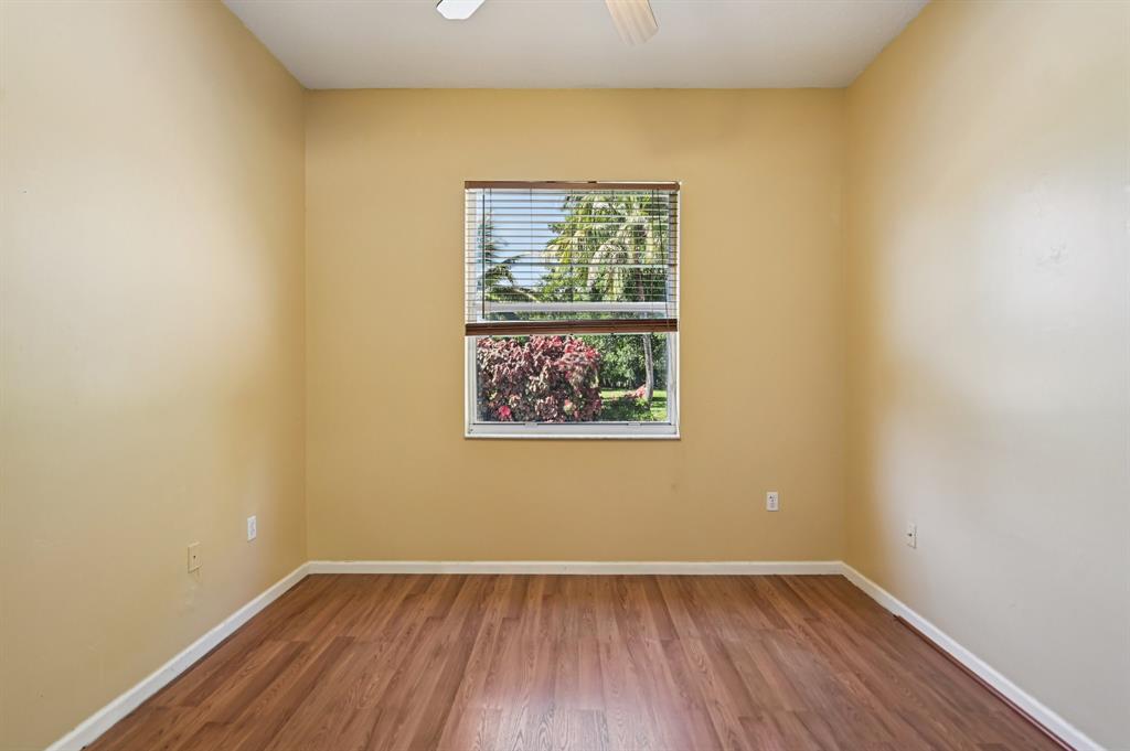 4181 Southwest 141st Avenue Davie, FL 33330 - Photo 38 of 61 a view of an empty room with wooden floor and a window