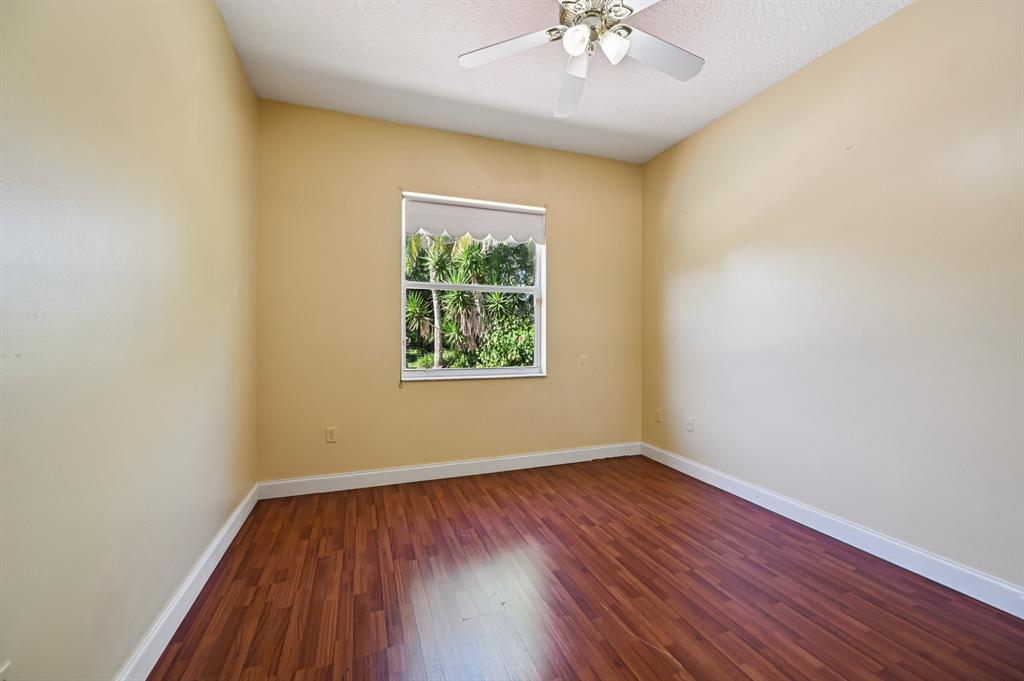 4181 Southwest 141st Avenue Davie, FL 33330 - Photo 39 of 61 an empty room with a window and wooden floor