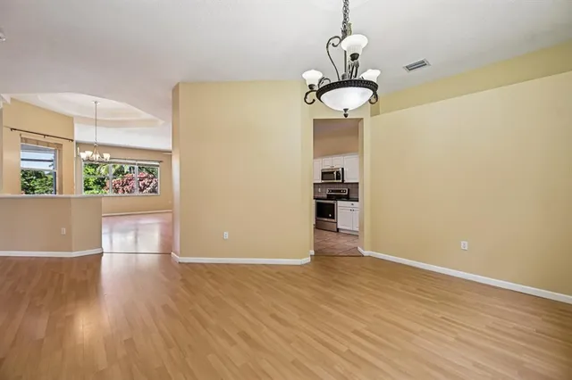 a kitchen with stainless steel appliances a refrigerator sink and cabinets