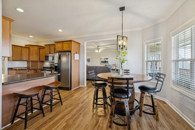 a bed sitting in a room and dresser