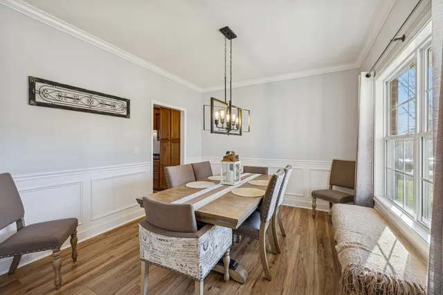 walk in closet with wooden floor