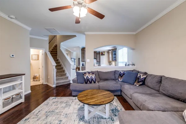 a living room with furniture and a rug