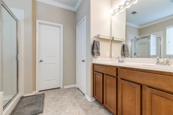 a bathroom with a double vanity sink mirror and