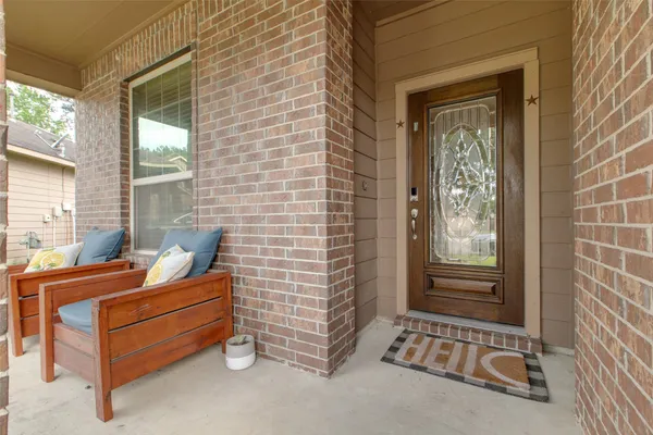 a view of a room with furniture and windows