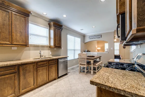 a kitchen with lots of counter top space and appliances