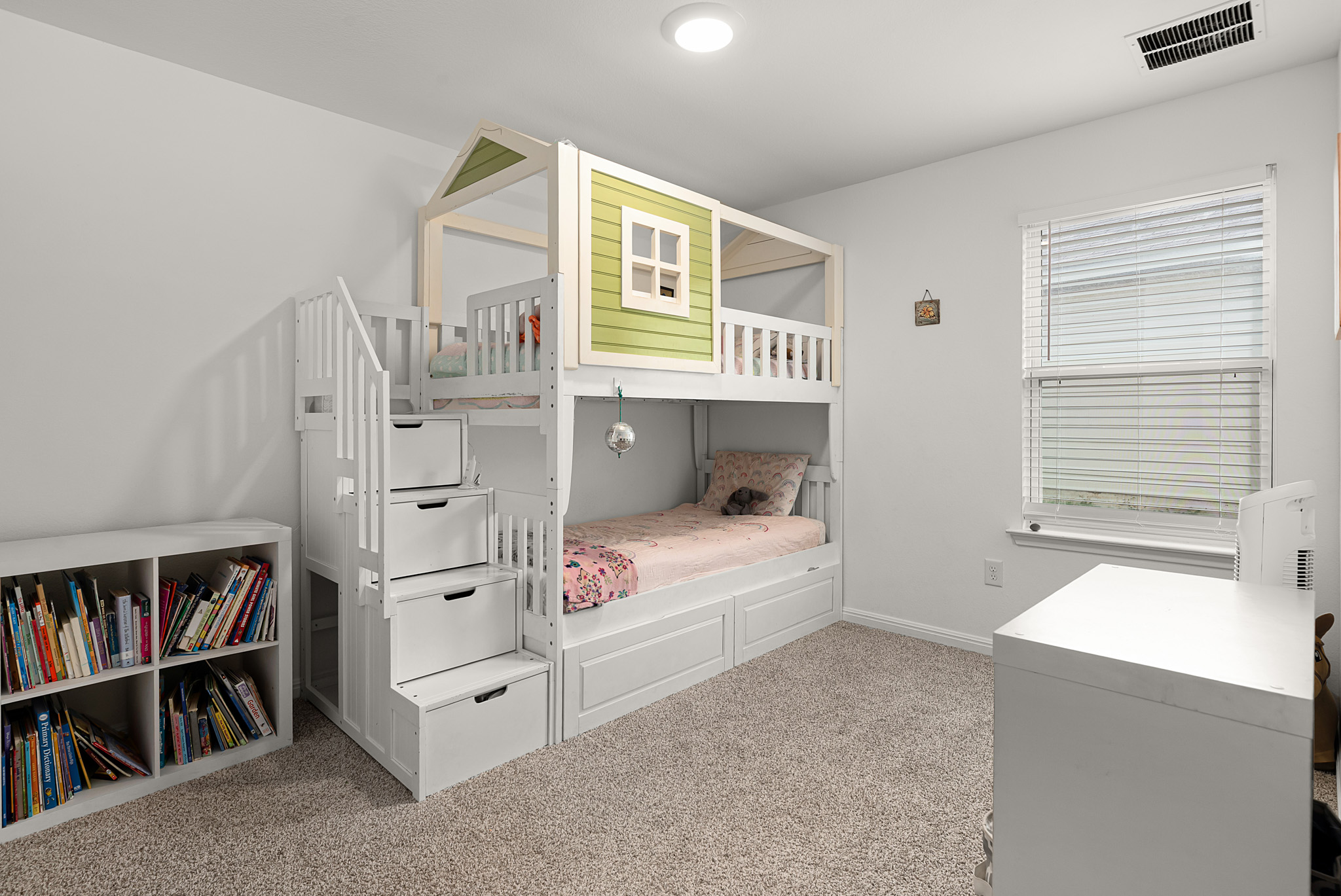 165 Santa Rosa Lane Buda, TX 78610 - Photo 12 of 21 a bedroom with a bed and a book shelf