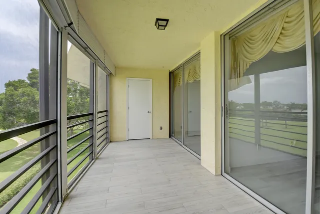 a view of a swimming pool with a yard