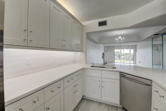 a kitchen with white cabinets