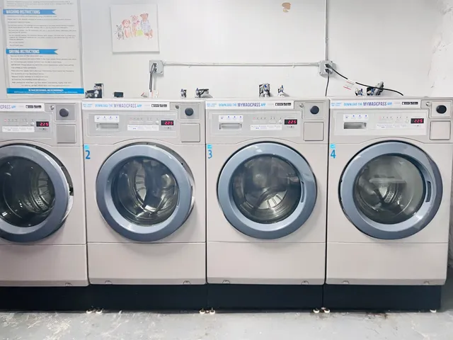 a utility room with dryer washer and a view of room