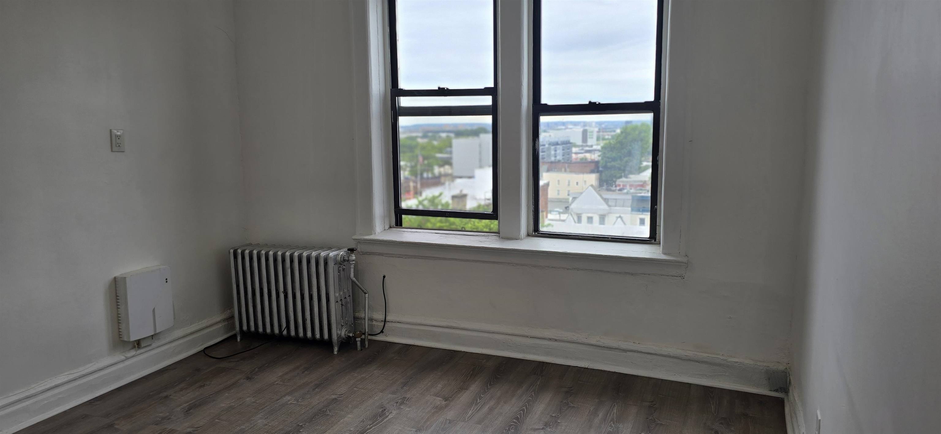 277 Harrison Avenue, Unit E4 Jersey City, NJ 07304 - Photo 7 of 13 an empty room with a window