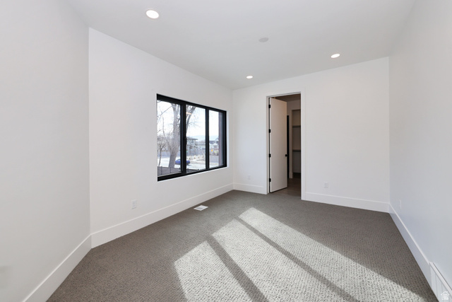 1306 East Victor Lane Draper, UT 84020 - Photo 46 of 60 Unfurnished bedroom featuring carpet flooring, recessed lighting, and a baseboard radiator