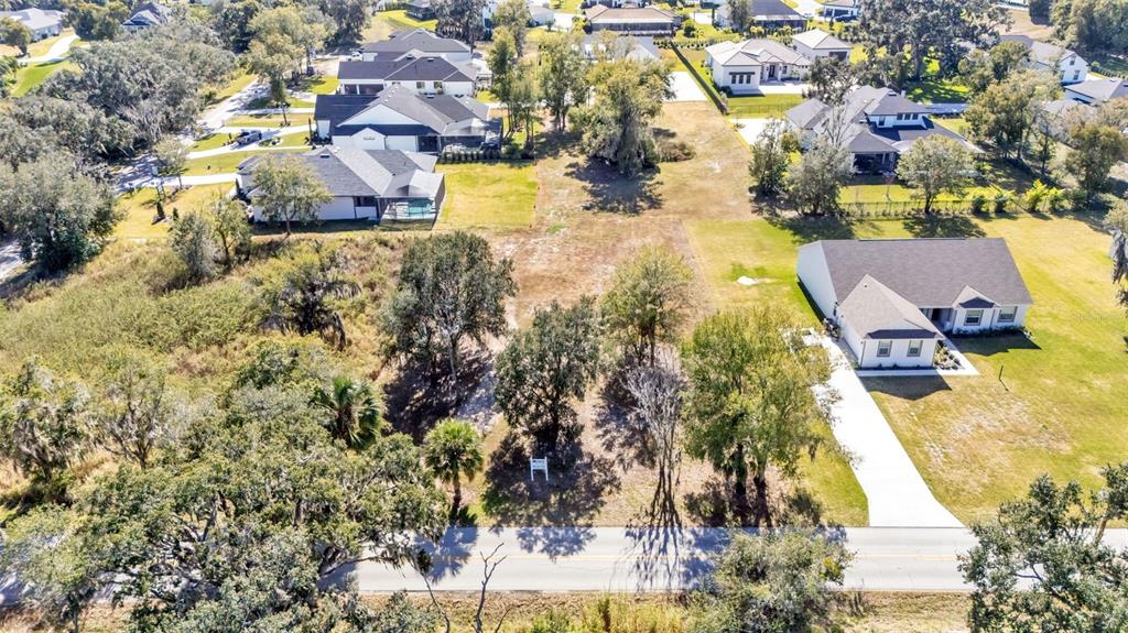 2577 Rogers Road Lakeland, FL 33812 - Photo 8 of 8 an aerial view of residential houses with outdoor space
