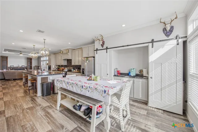 a bathroom with a granite countertop sink a mirror and a vanity