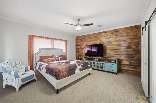 a bedroom with a bed and a table in it