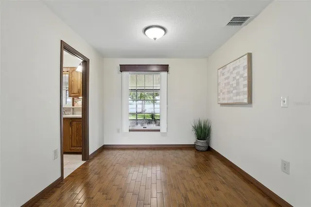 a view of a livingroom with furniture and a wooden floor