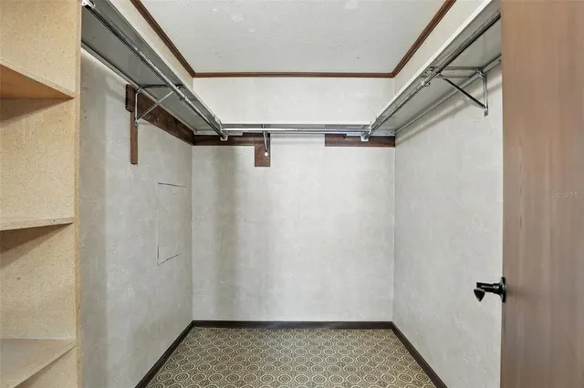 a bathroom with a granite countertop sink toilet mirror and shower